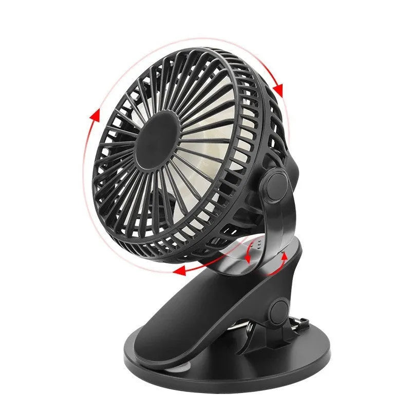 White USB rechargeable mini clip fan with plastic blades attached to a desk edge.