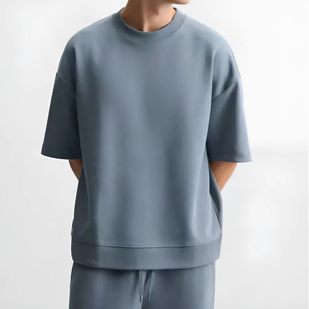 Loose fit double-sided texture polyester co-ord set with short sleeve shirt and shorts in blue.