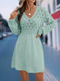 Apricot coloured V-neck long sleeve dress with a high waist and 3D pattern details.