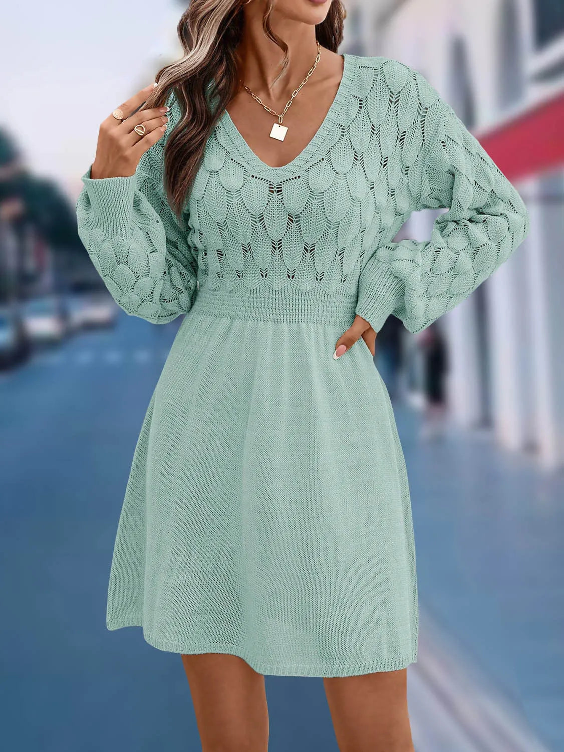 Apricot coloured V-neck long sleeve dress with a high waist and 3D pattern details.