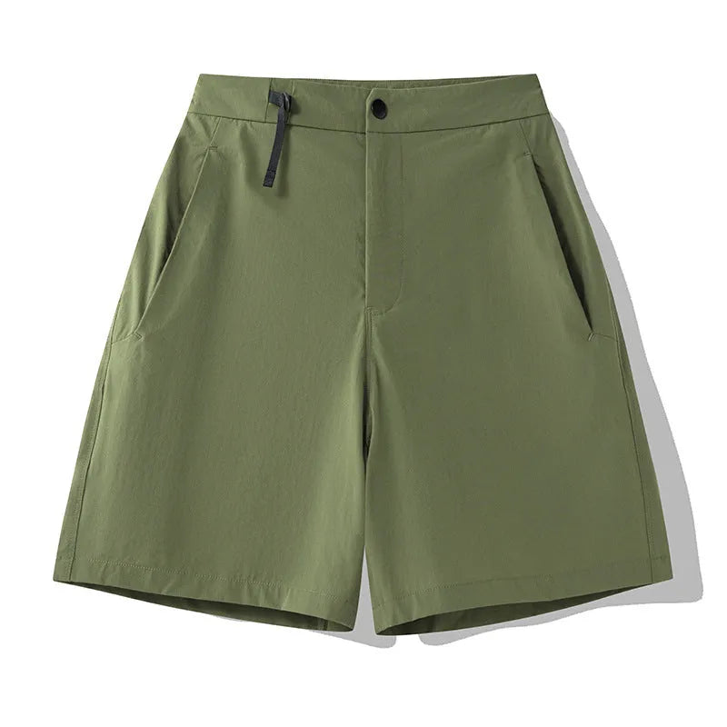Men's khaki quick-drying sports shorts with 3D cut and elastic waistband laid flat.