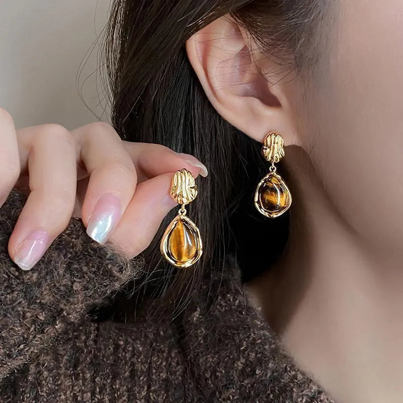 Three pairs of handmade geometric earrings with tassel details in gold electroplated finish
