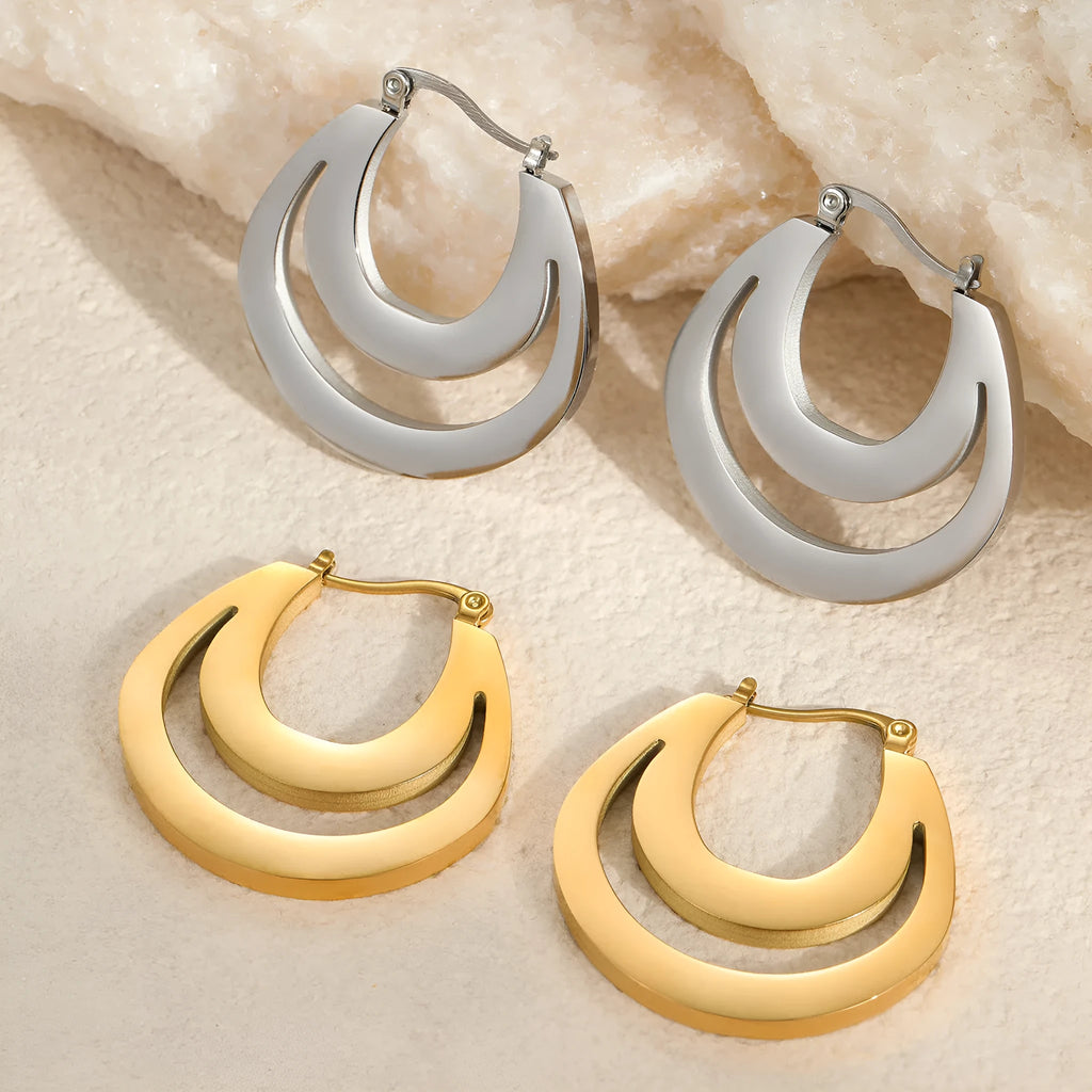 Geometric minimalist French earrings in gold or steel finish with round ring design elements