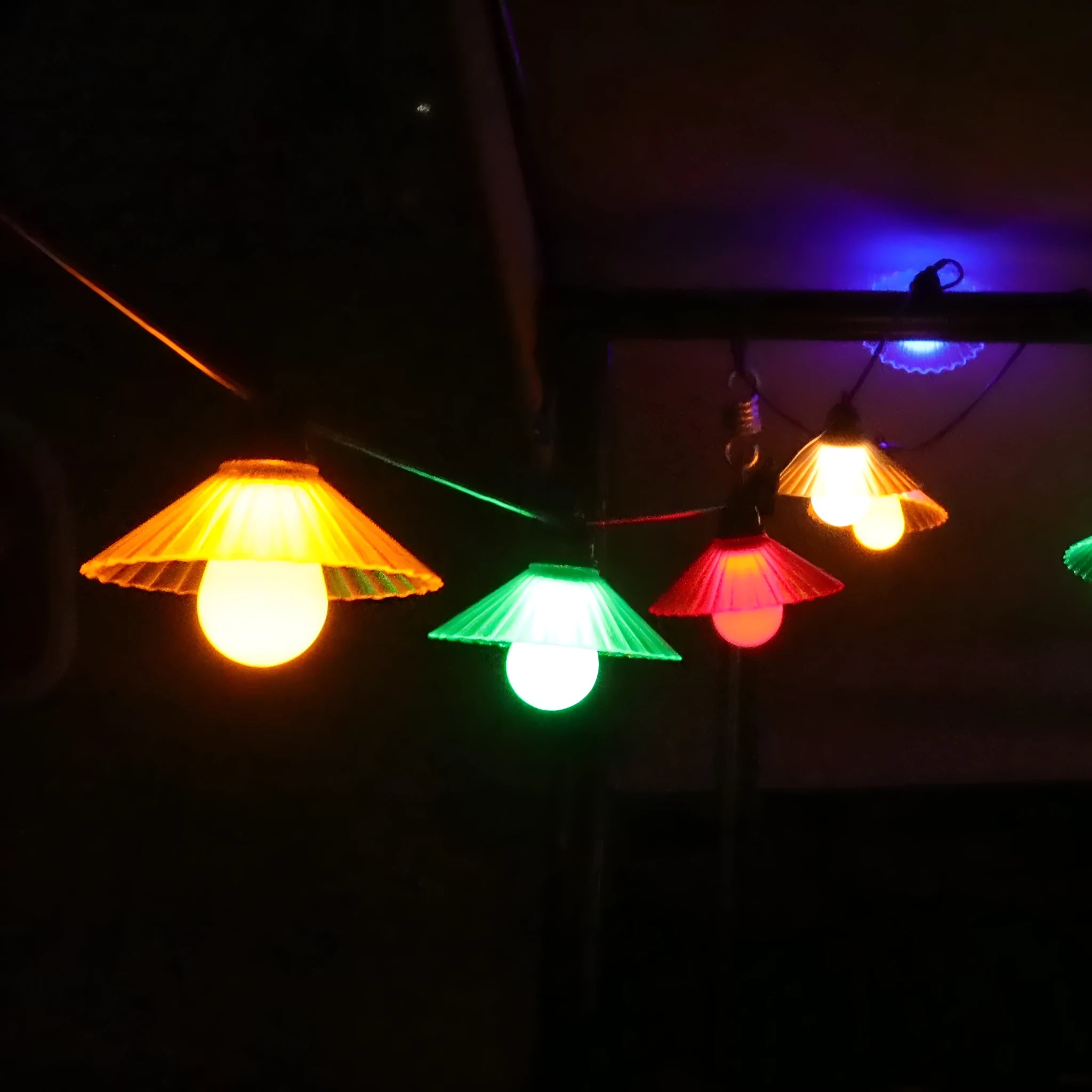 Outdoor LED string lights with flower-shaped globe bulbs in warm white or multicolour options
