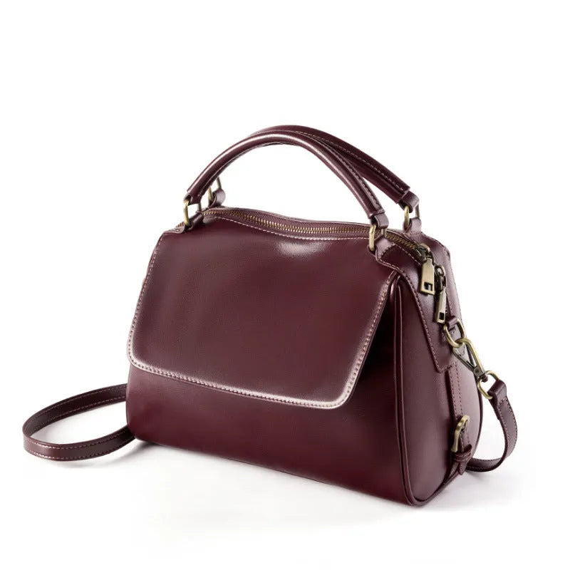 Women's genuine leather crossbody tote bag in apricot colour showing outer slit pocket and double shoulder straps
