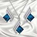 Women's alloy and glass cross chain necklace with matching electroplated stud earrings jewellery set