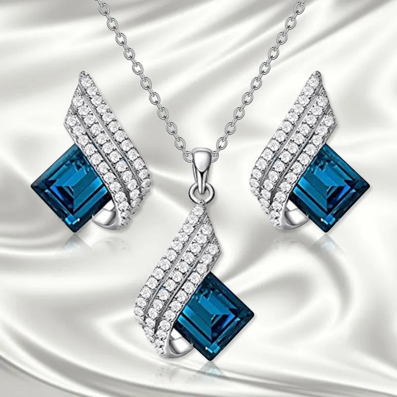 Women's alloy and glass cross chain necklace with matching electroplated stud earrings jewellery set
