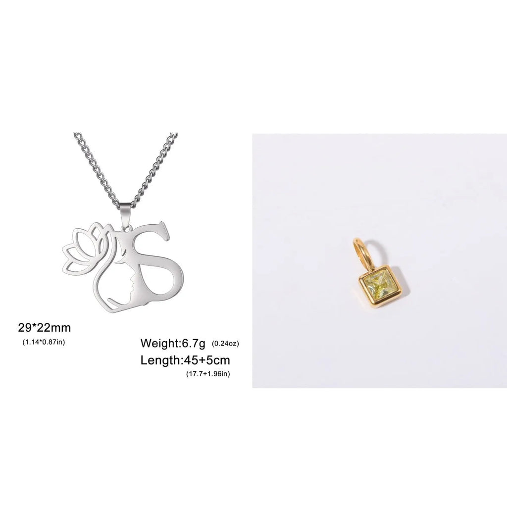 Stainless steel letter necklace with cross chain and single initial pendant in gold tone.