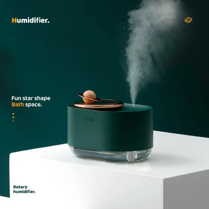 Rotating planet USB humidifier with night light in green colour showing mist output