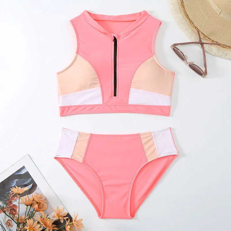 Pink high-waist split bikini swimsuit with matching bra and briefs on solid background