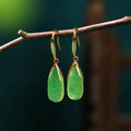 Retro geometric Chinese style earrings with water droplet design in electroplated jade colour.