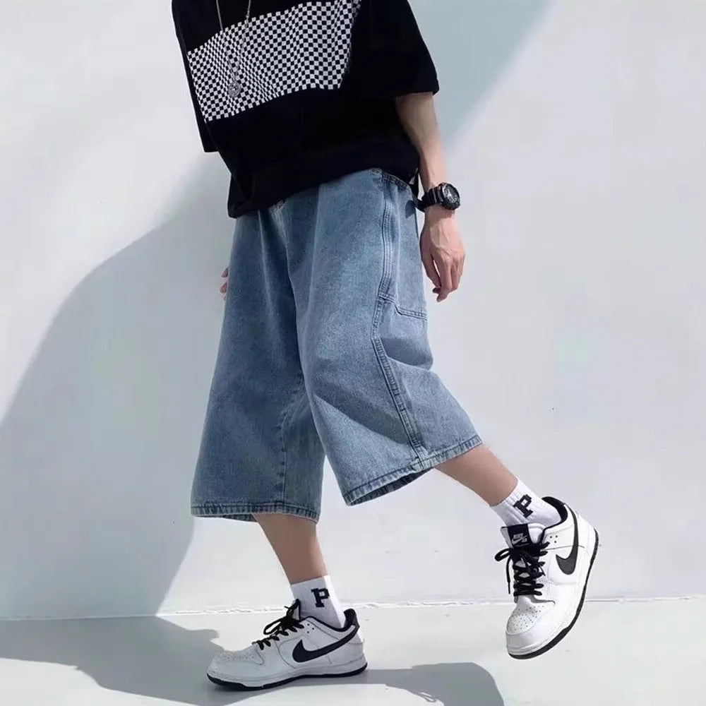 Blue washed denim men's pirate shorts with a high waist and straight legs on a white background.