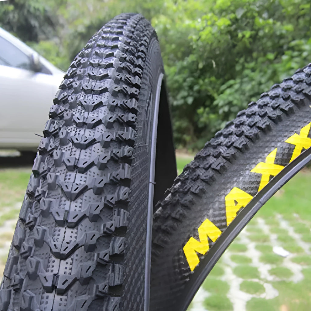 Ultralight mountain bike tyre with reinforced sidewall shown in black, suitable for 26, 27.5 or 29 inch wheels