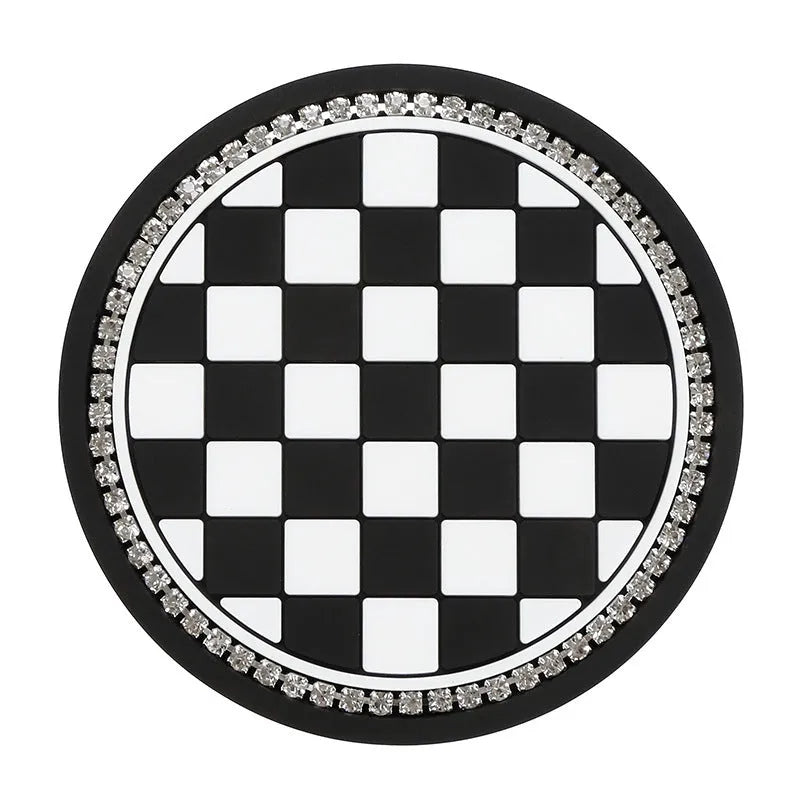 PVC car cup holder mat in black and white checkerboard pattern showing dimensions of 15.2 by 10.1 centimetres