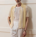 Yellow casual polo shirt with hollow-out detailing and asymmetric design, short sleeves for summer wear
