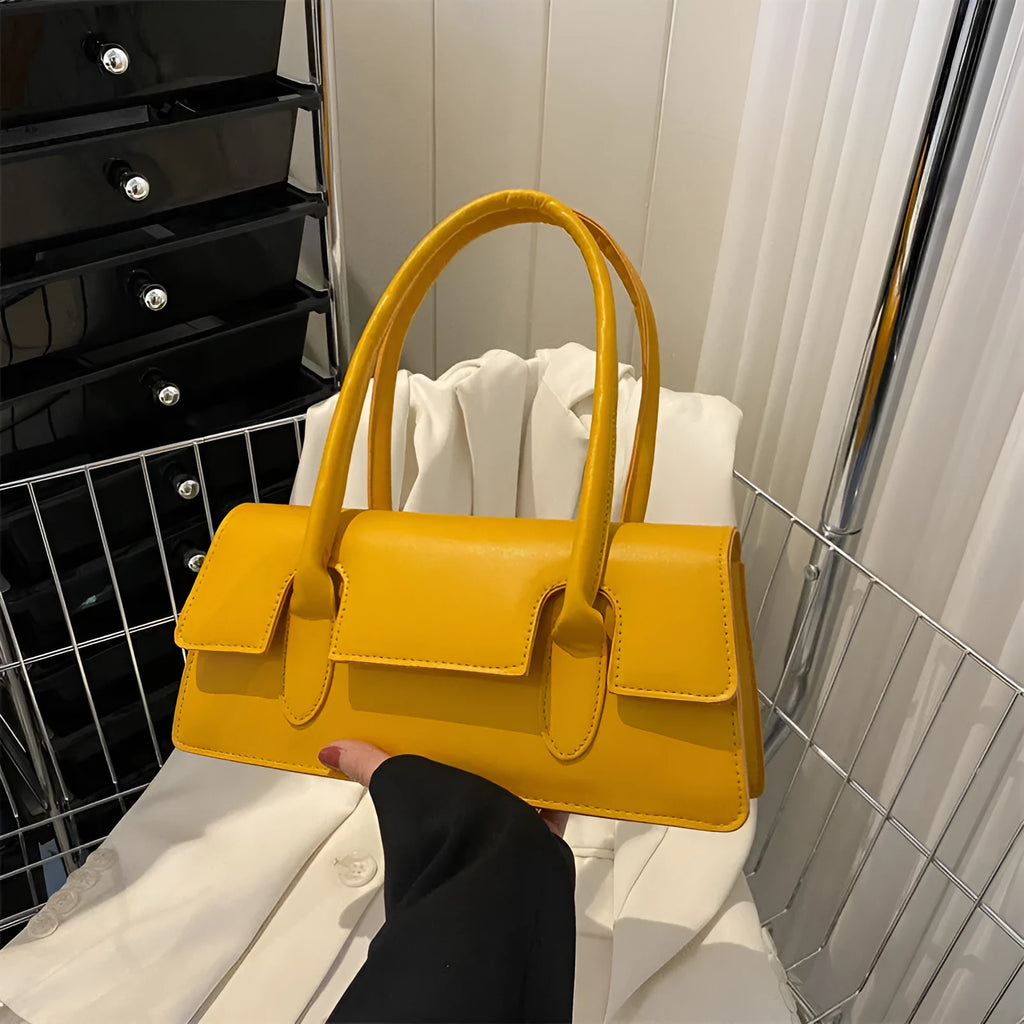 Women's small square shoulder bag in PU leather with stitching detail, shown in yellow colour