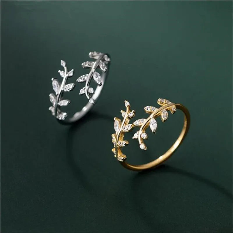 Women's leaf-shaped branch fashion ring in copper with gold or silver electroplated finish.