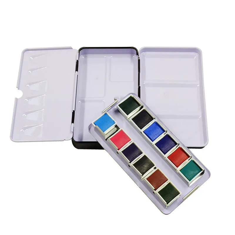 Empty tinplate watercolour paint box shown in three different folding sizes for artist pigments.