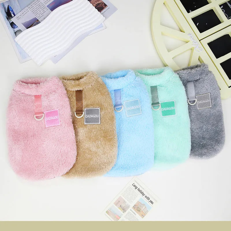 Fluffy blue coral fleece pet jacket with multi-coloured pull ring fastening on a dog model.