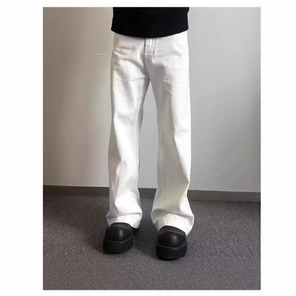 Men's white straight-leg cotton denim jeans on a plain background.