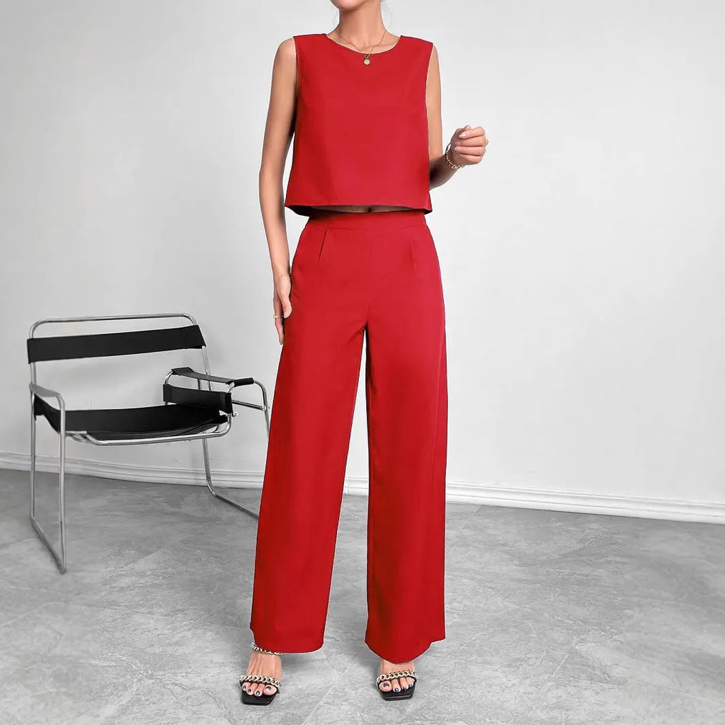 Red polyester two-piece set with sleeveless top and wide leg trousers