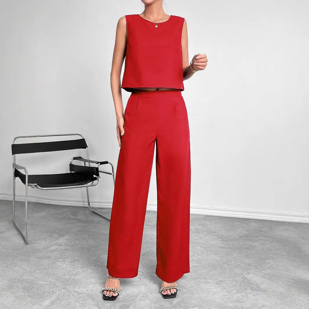 Red polyester two-piece set with sleeveless top and wide leg trousers