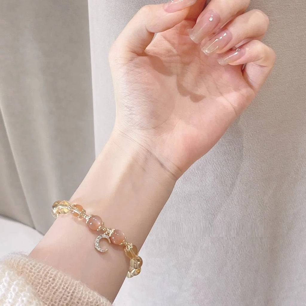 Chinese style crystal bracelet with 14K gold electroplated finish and diamond-shaped design