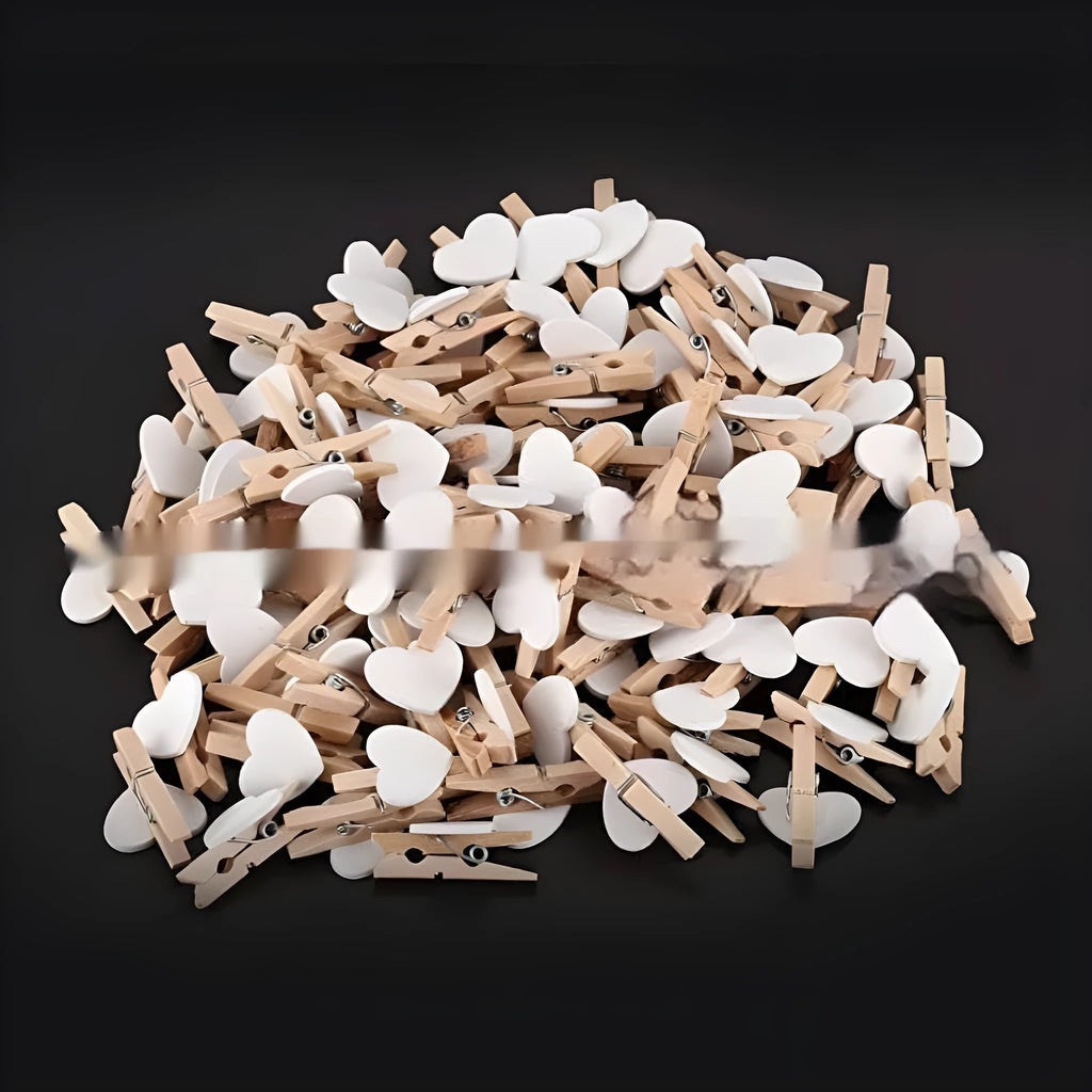 Set of five handmade solid wood heart-shaped clips in various colours
