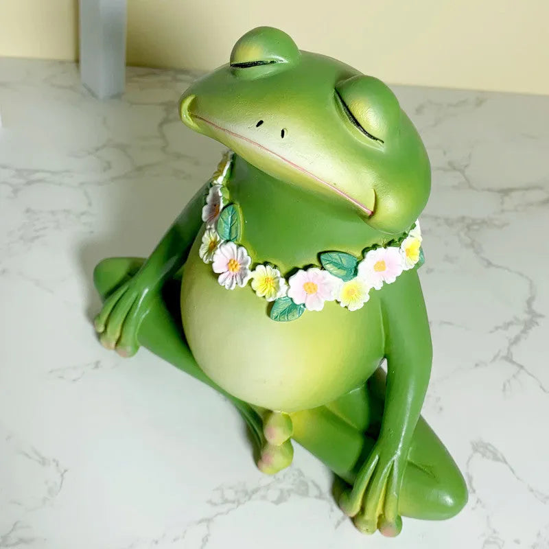 Magic Yoga Frog plastic and resin ornament in RDW123 colour on a shelf.