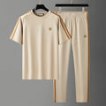 Men's blue ironing-free short sleeve polyester sports suit consisting of a top and pants