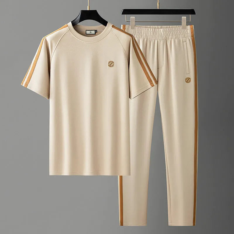 Men's blue ironing-free short sleeve polyester sports suit consisting of a top and pants