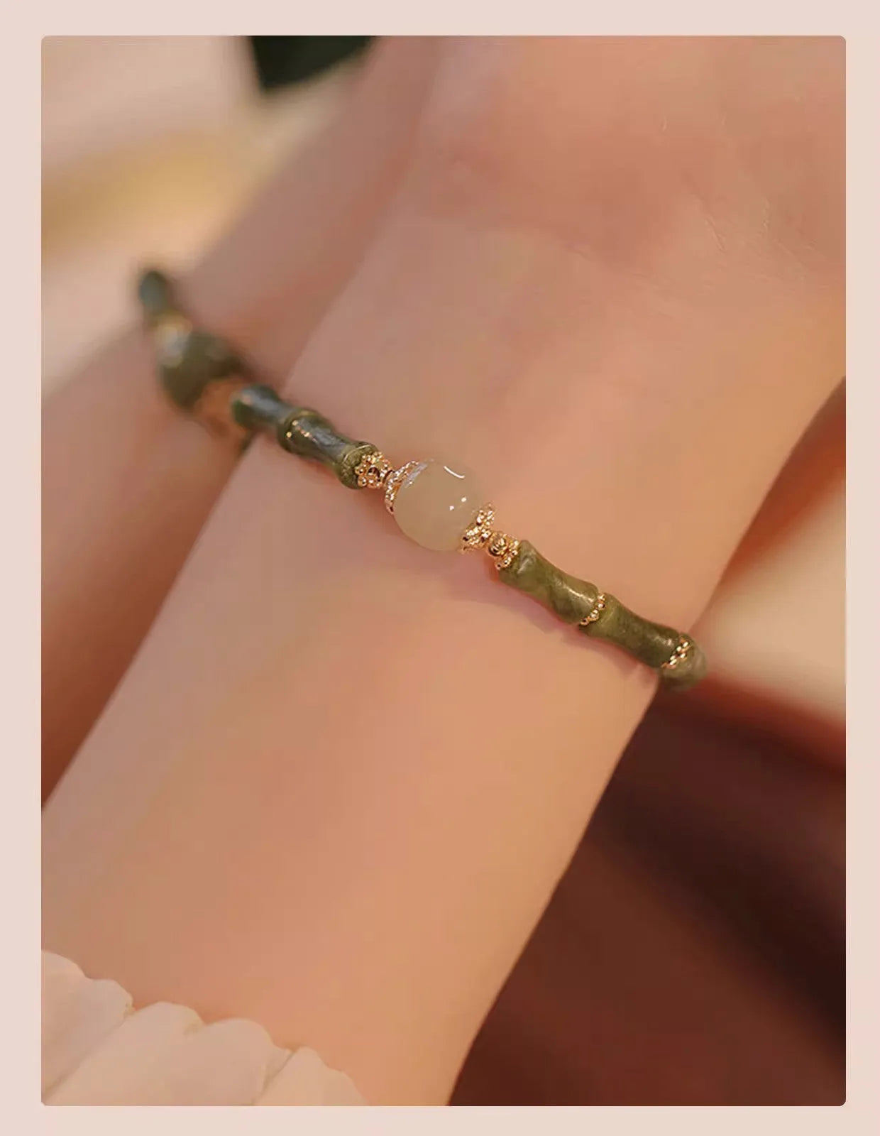 Dark green Hetian jade bracelet with geometric bamboo festival design on wrist