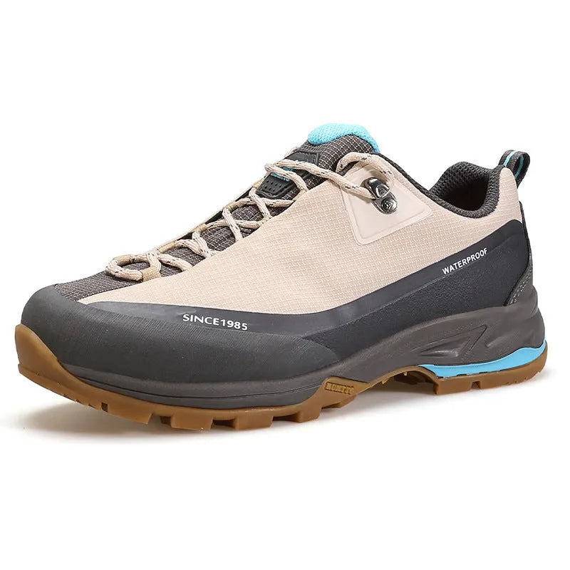 Low-top mountain climbing shoes with leather mesh upper and non-slip rubber sole in black-red and beige-maroon colour options for men and women.