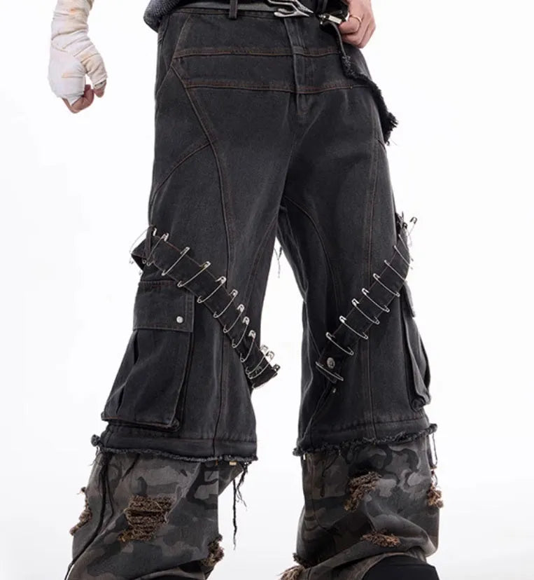 Grey camouflage men's jeans with panel splicing construction and ribbon detailing.