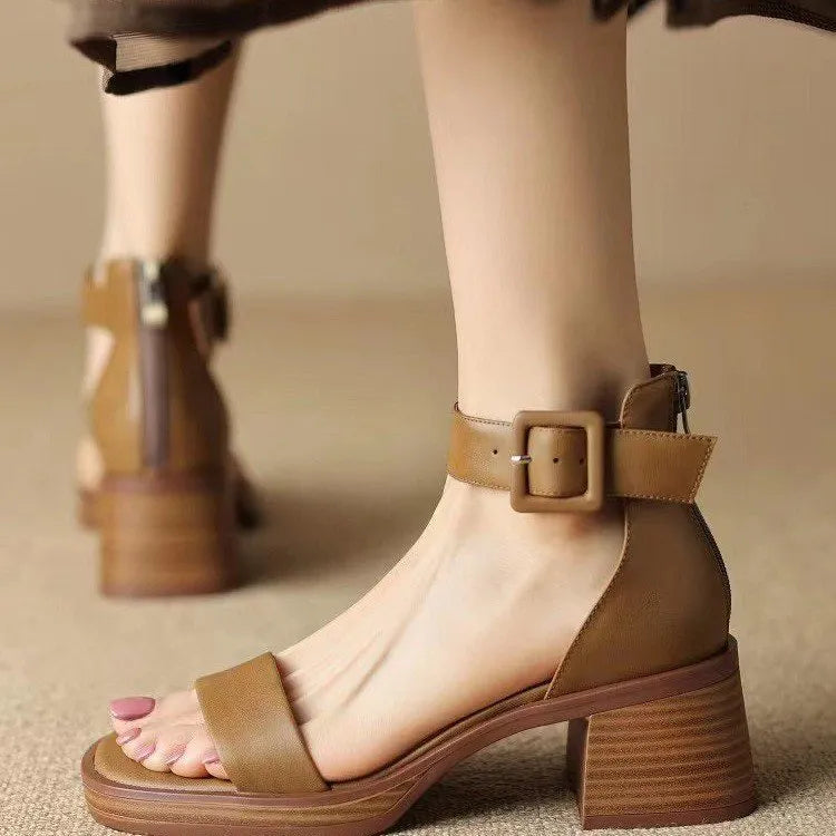 Women's white retro ankle-strap platform high heels with a round toe.