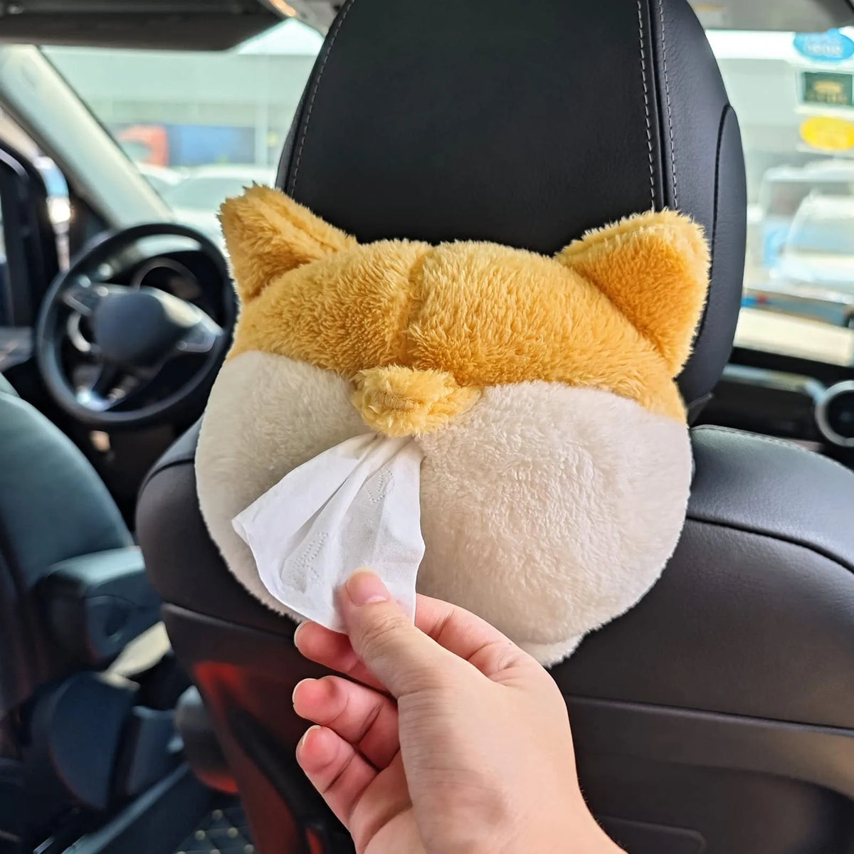 Yellow corgi butt shaped soft polyester car tissue box cover hanging on a sun visor.