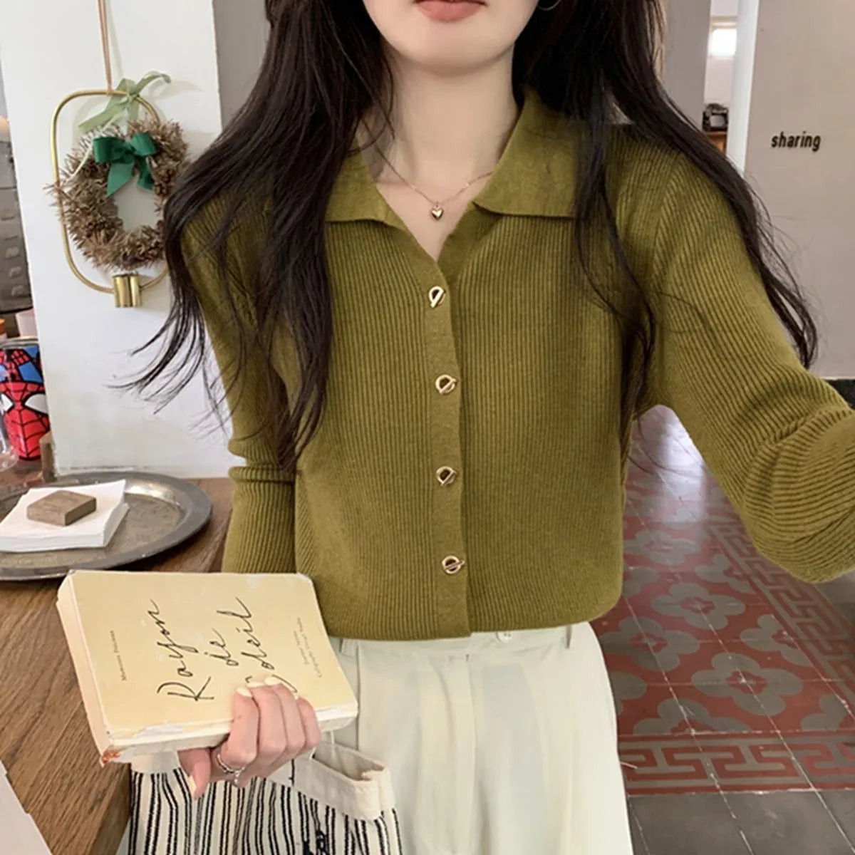 Beige viscose knitted long-sleeved cardigan with loose fit design on hanger
