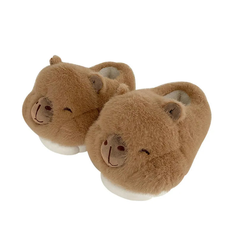 Light brown women's winter slippers with plush cotton upper and cartoon pattern.
