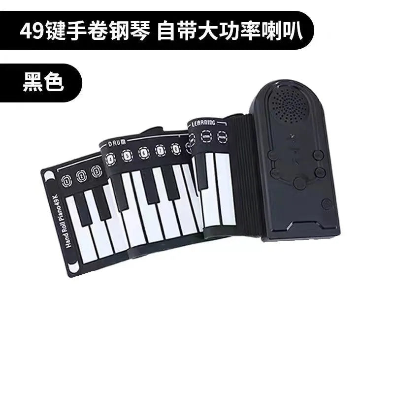Portable black folding electronic keyboard rolled up next to its control panel and cable.