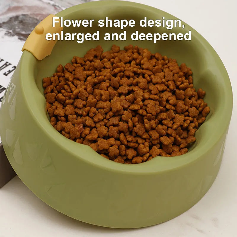 Green plastic pet bowl with dual compartments for food and water, anti-tipping design