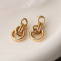 Gold-colour geometric earrings with irregular shapes and INS high-profile design