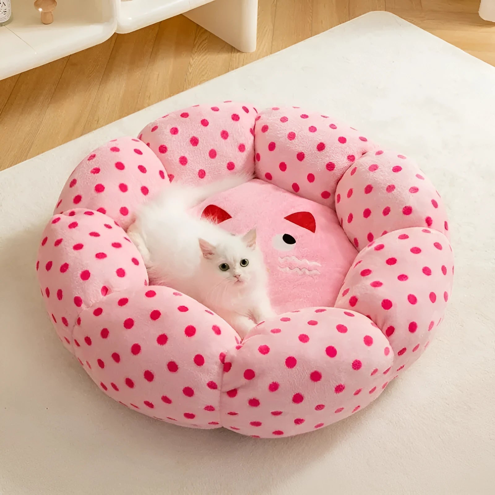 Pink dot fabric cat bed with fully cushioned design in 45cm and 65cm diameter sizes