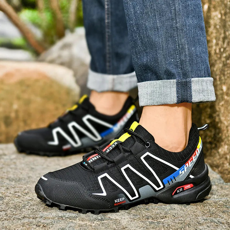Men's plus size grey orange casual running shoes with low-top design and rubber sole.