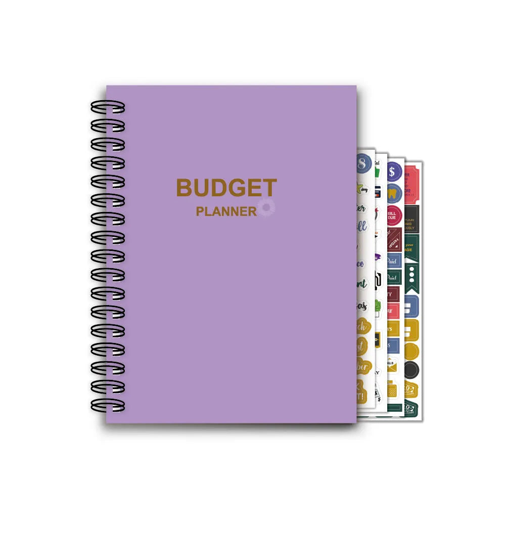 Purple coil-bound budget planning notebook with pen, stickers, and paper clips for financial organisation