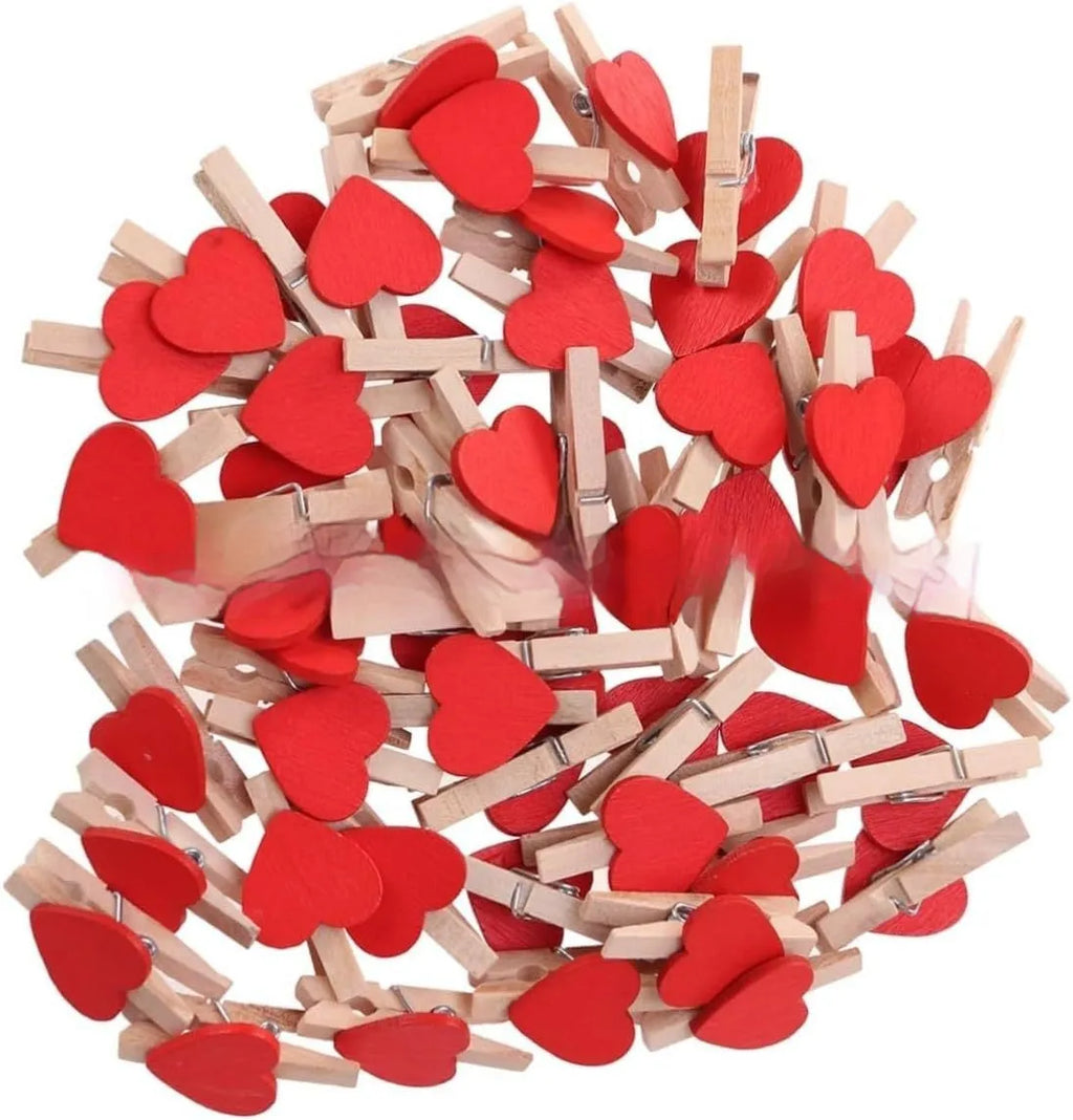 Set of five handmade solid wood heart-shaped clips in various colours