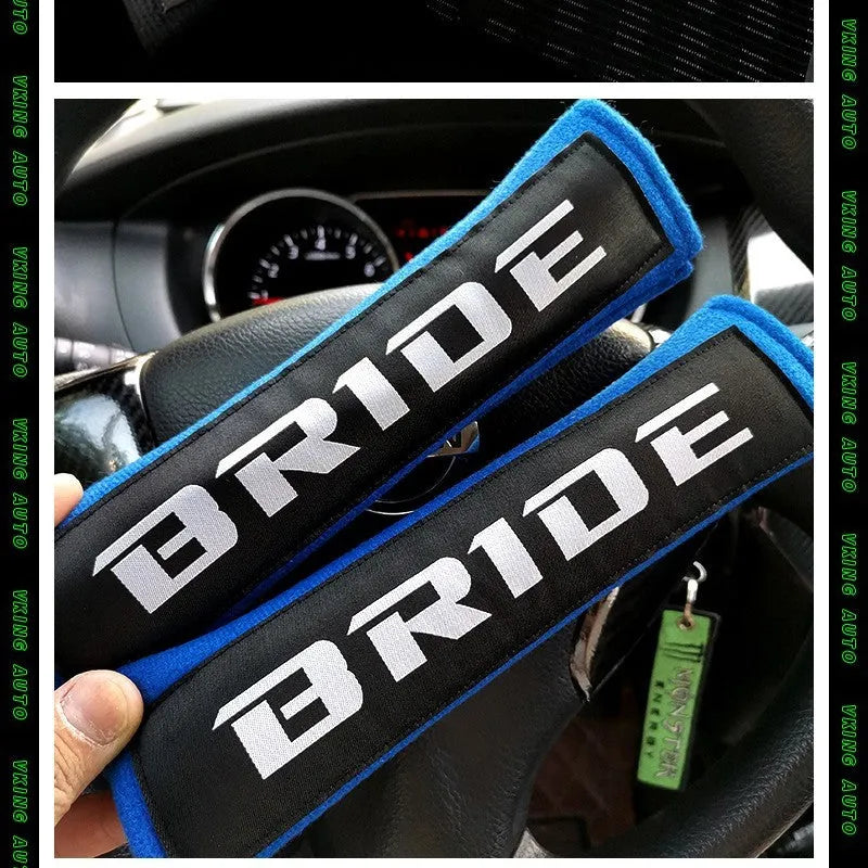 Car seat belt shoulder pads in black, blue, and red colours showing cotton sponge cloth with embroidery weaving