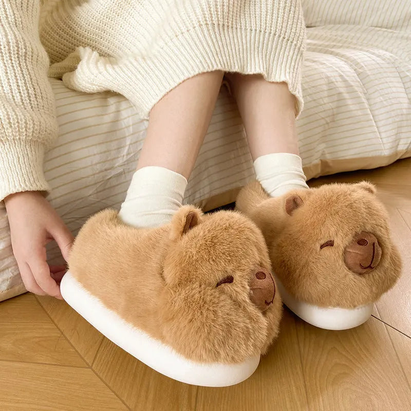 Light brown women's winter slippers with plush cotton upper and cartoon pattern.