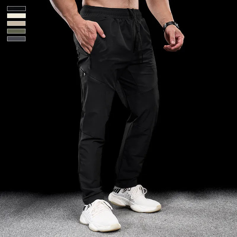 Men's waterproof quick-drying nylon workout pants in Army Green colour, showing mid waist design and trousers length