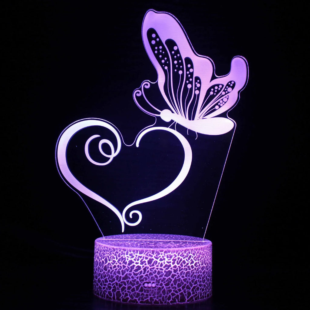 Small colourful 3D acrylic USB table lamp with touch control and crack-design base on a wooden desk.
