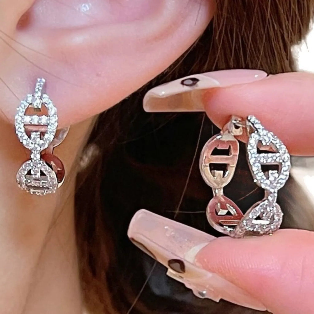A pair of casual ladies' diamond-effect earrings with thick gold electroplating.
